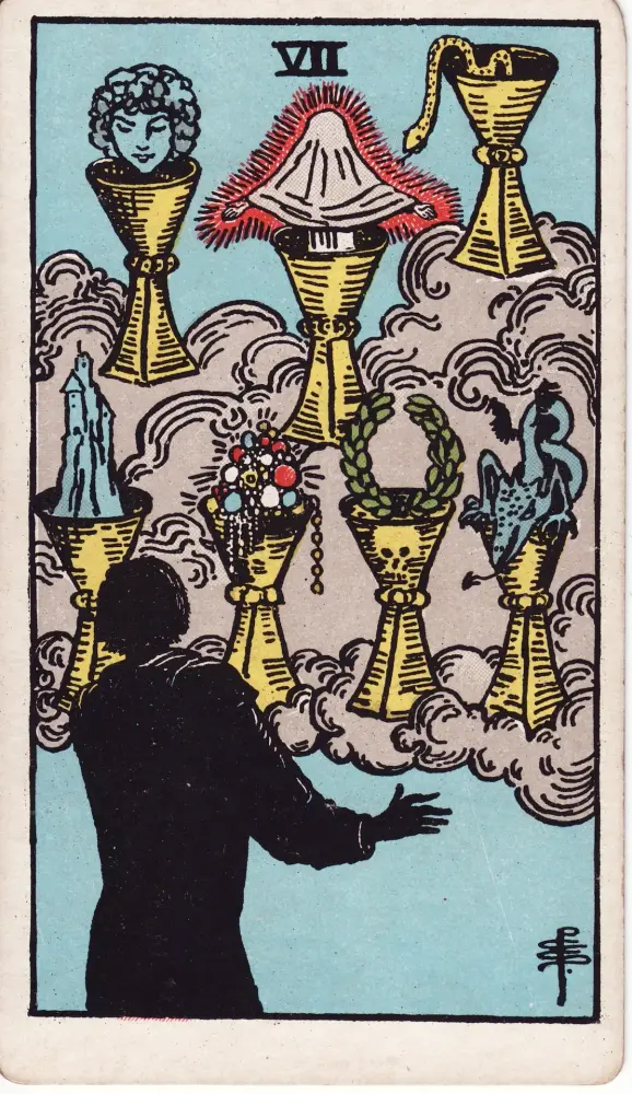 Lá Bảy Cốc trong công việc và tài chính: Lá Bảy Cốc (Seven of Cups) trong bộ Tarot Rider-Waite-Smith, bản in 1909